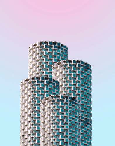 high rise gray concrete building under clear blue sky urban